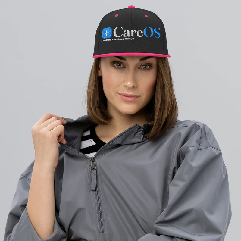 CareOS Snapback Hat in Black and Neon Pink, the CareOS lockup embroidered across the front